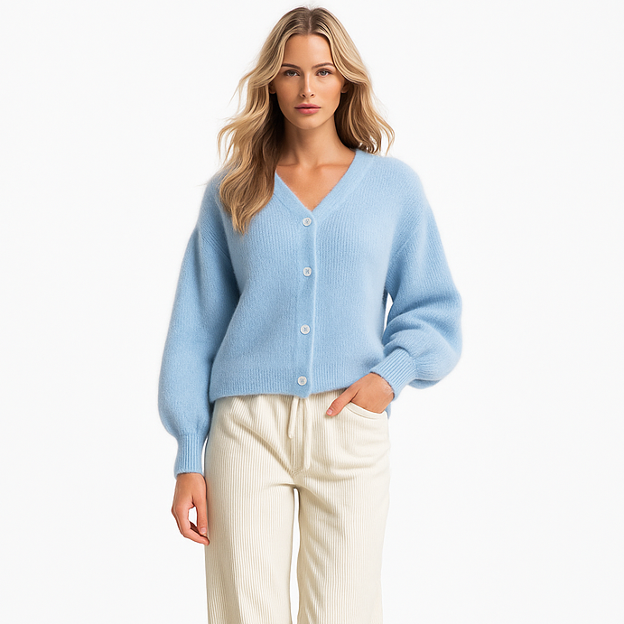 Giacca in maglia da donna con bottoni in madreperla e collo a punta elegante